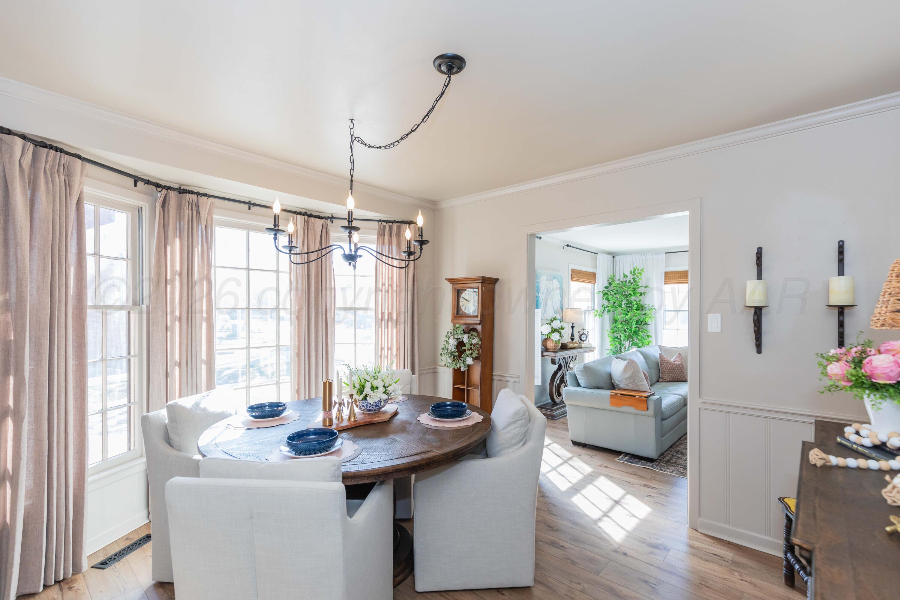 6308 Jameson Road Amarillo, TX 79106 - Photo 22 of 43 a view of a dining room with furniture window and wooden floor