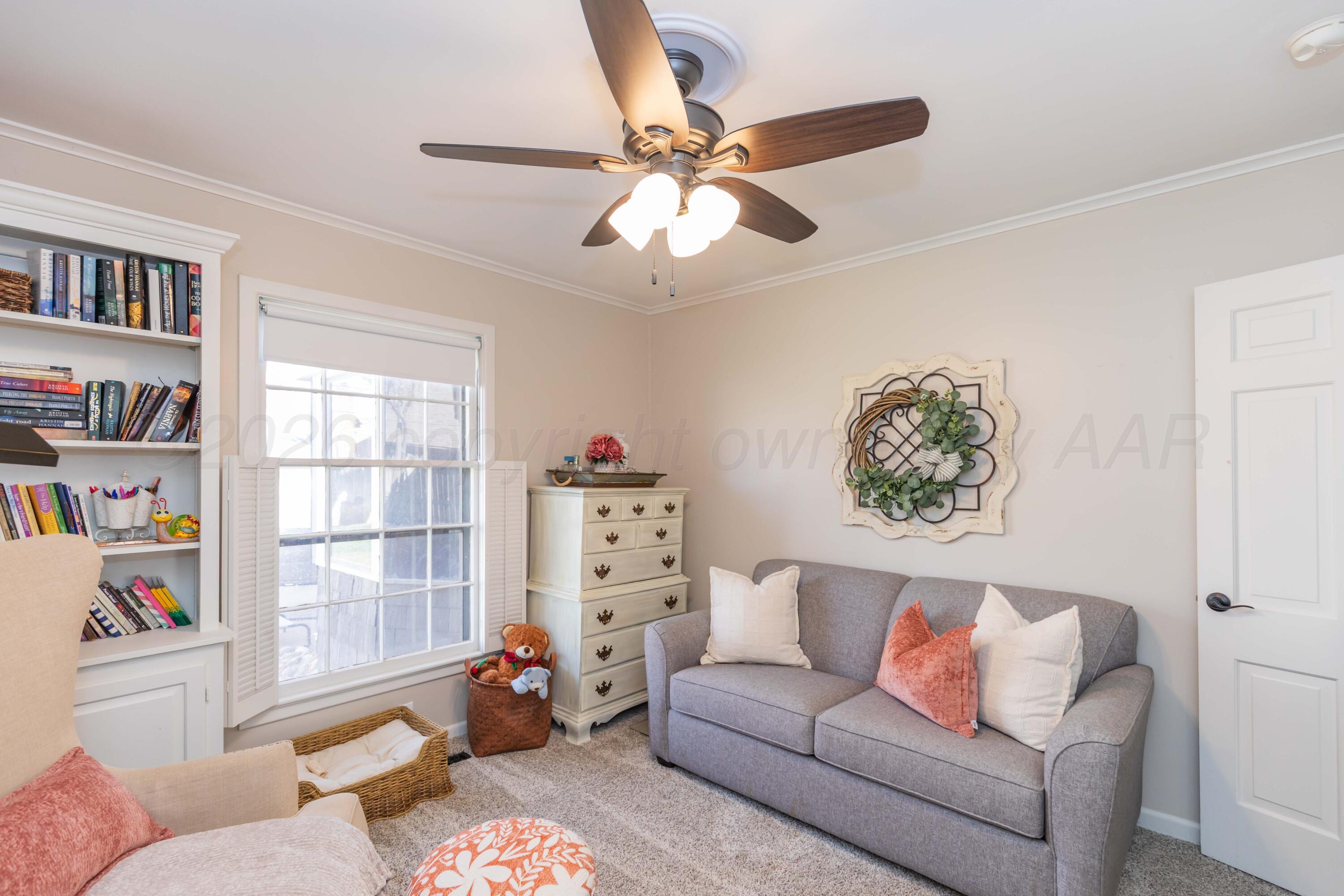6308 Jameson Road Amarillo, TX 79106 - Photo 25 of 43 a living room with furniture and a window