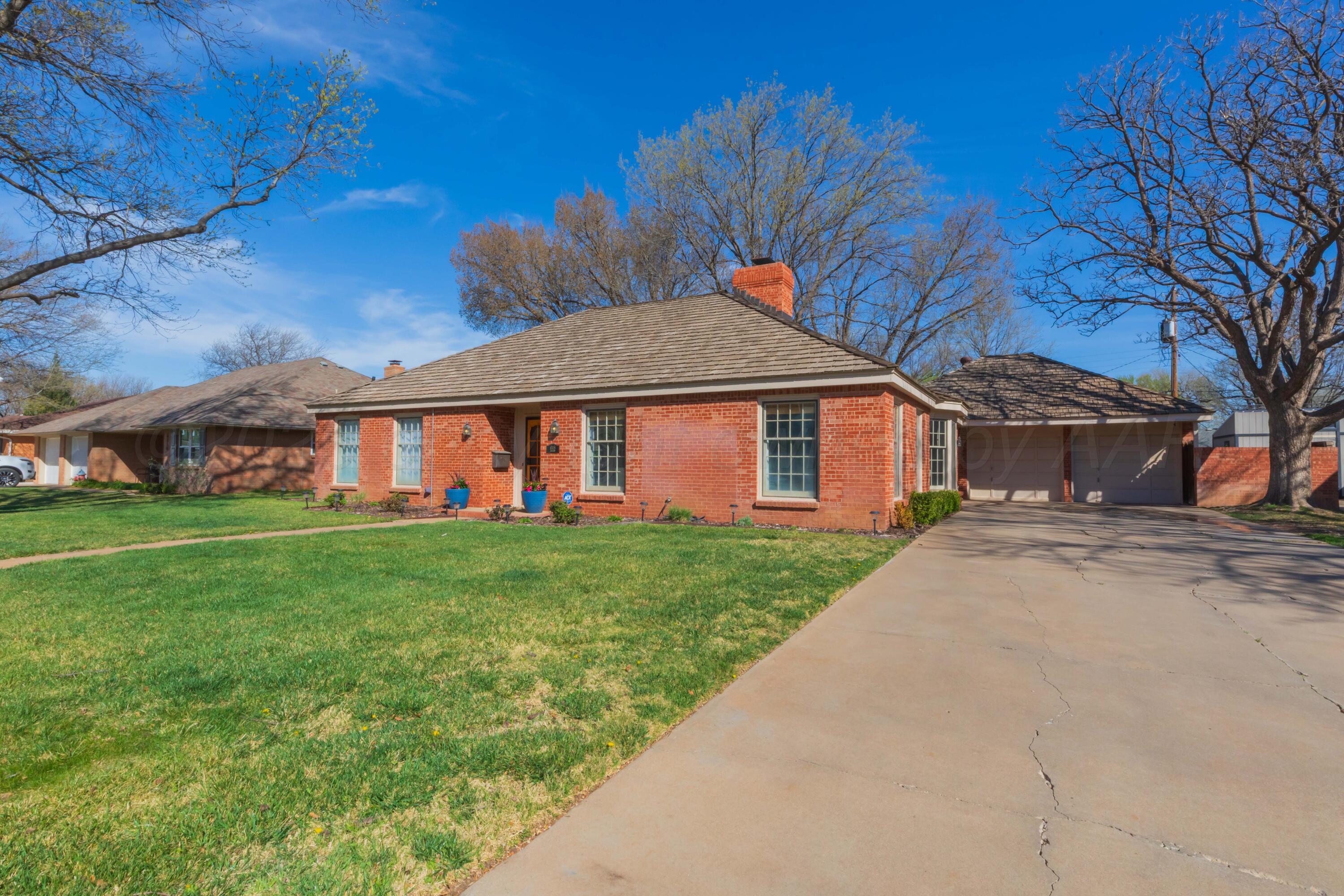 6308 Jameson Road Amarillo, TX 79106 - Photo 3 of 43 a view of a yard in front of a house