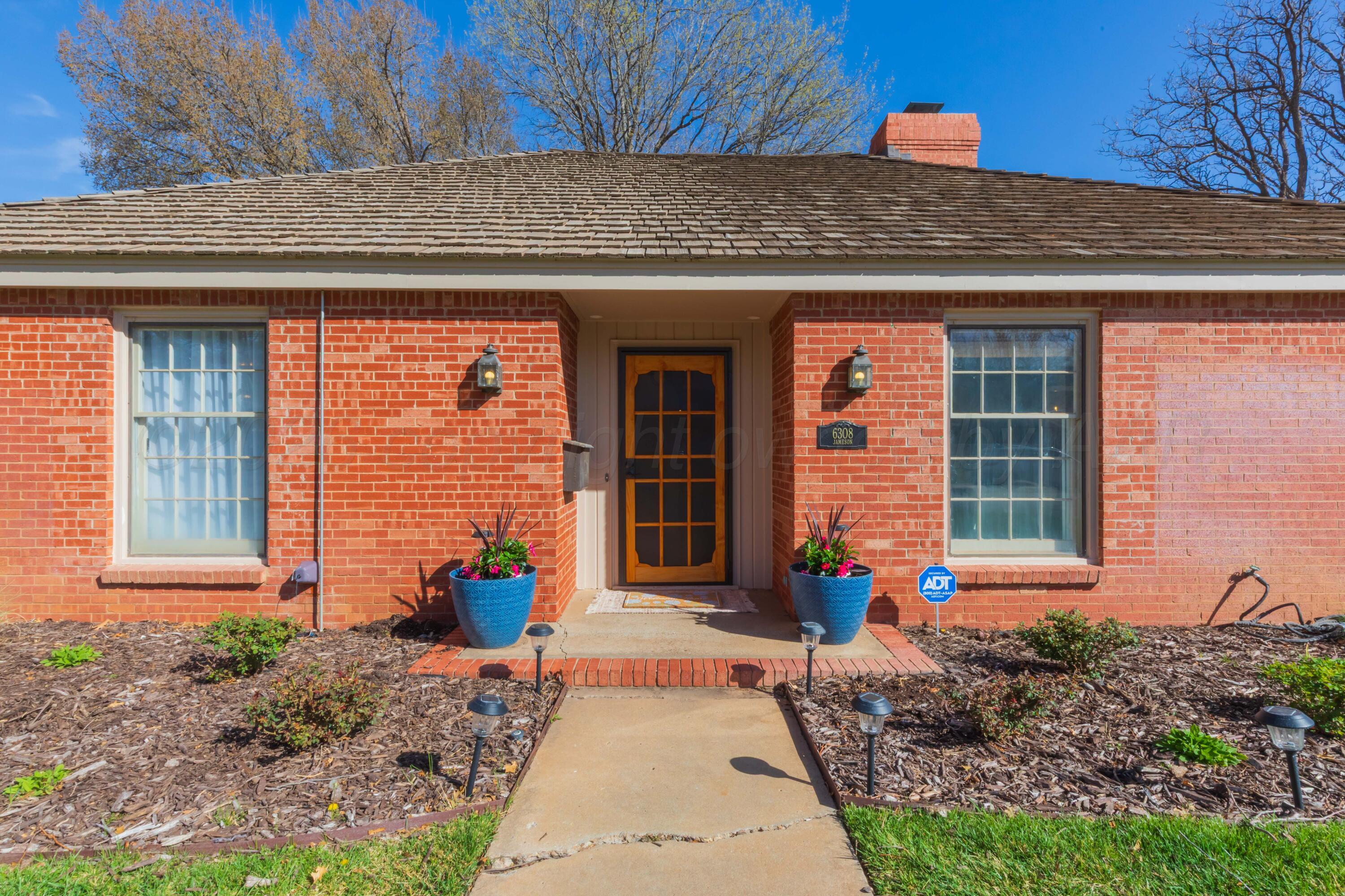 6308 Jameson Road Amarillo, TX 79106 - Photo 4 of 43 a front view of a house with outdoor seating