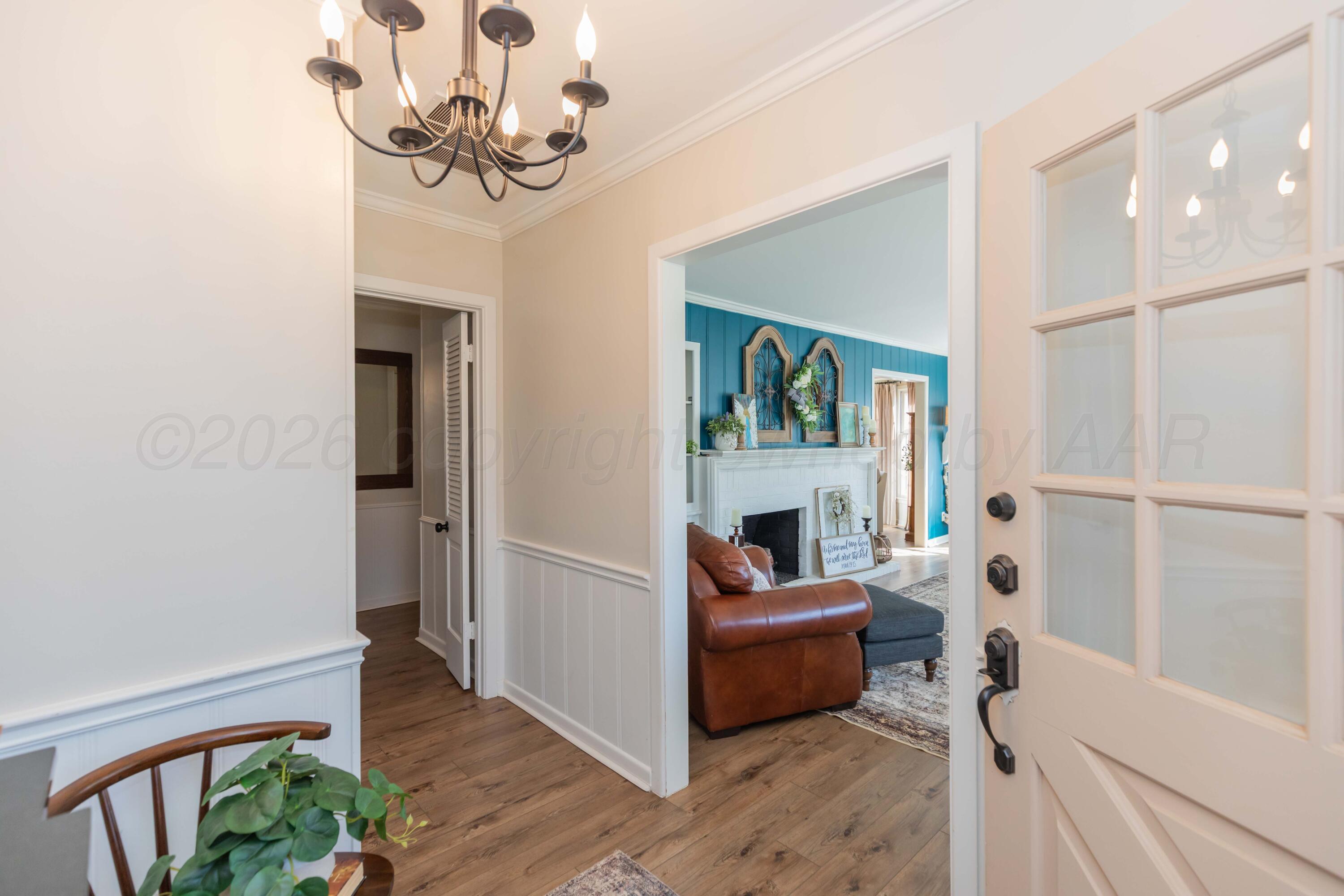 6308 Jameson Road Amarillo, TX 79106 - Photo 6 of 43 a living room with furniture and a fireplace