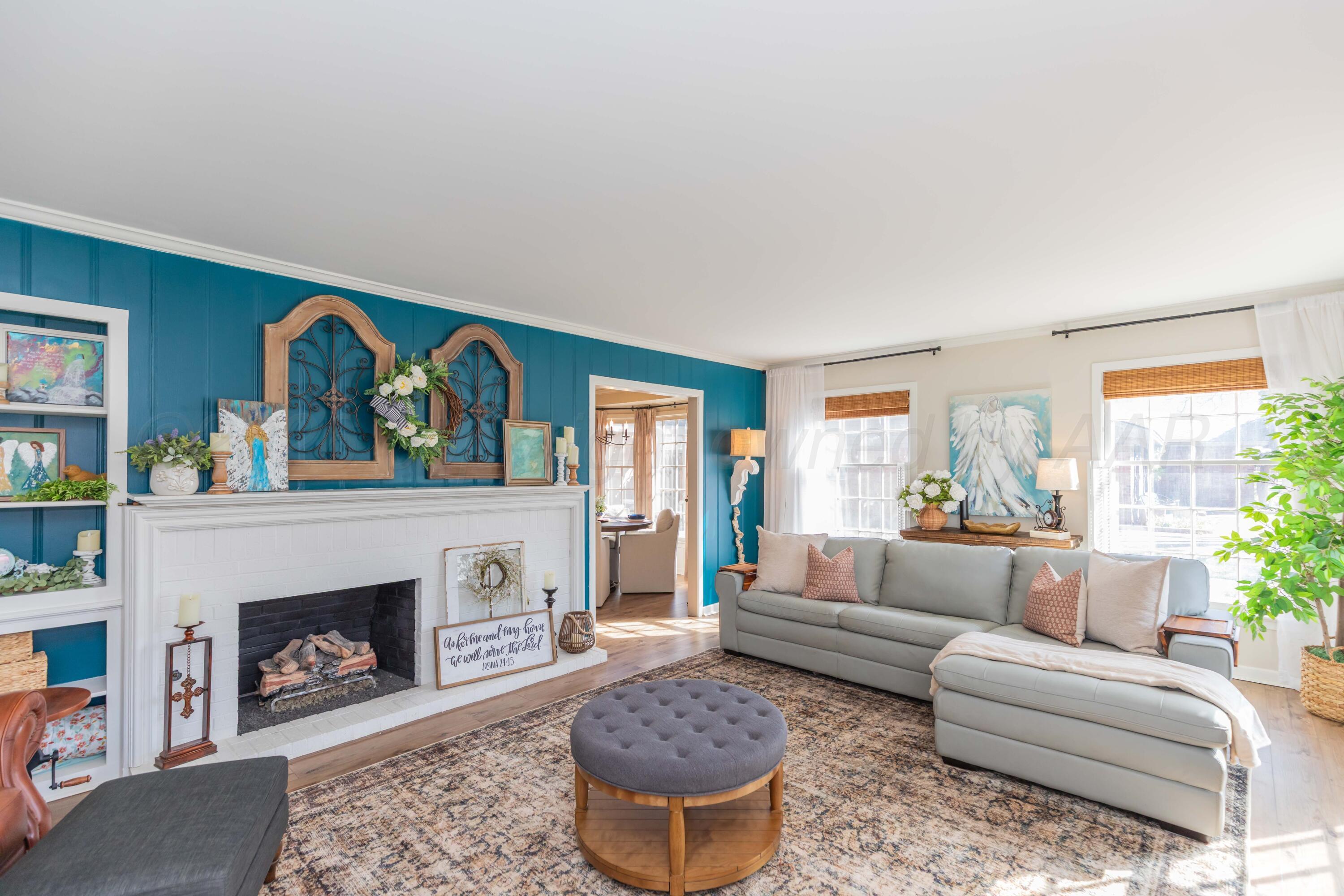 6308 Jameson Road Amarillo, TX 79106 - Photo 7 of 43 a living room with furniture and a fireplace