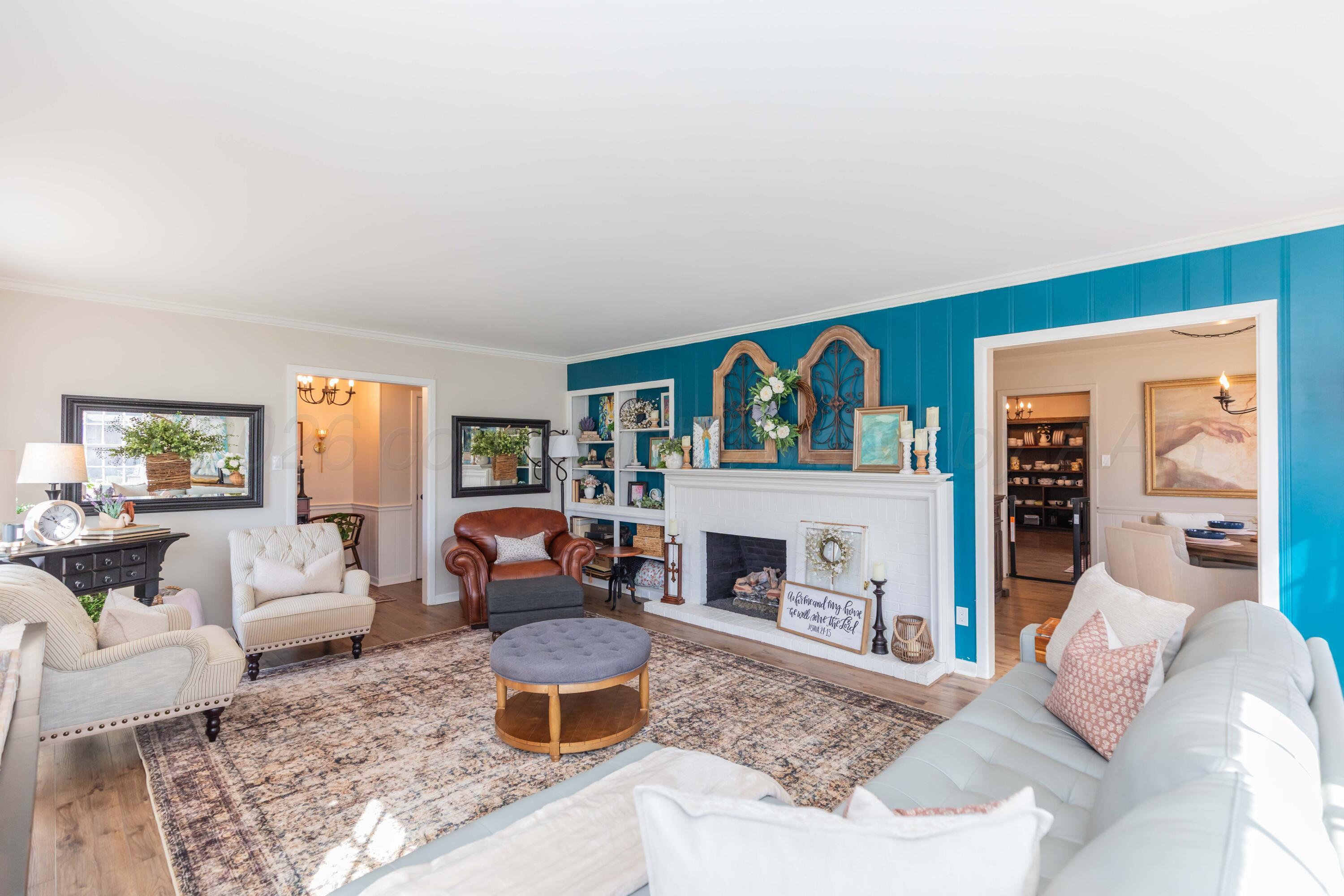 6308 Jameson Road Amarillo, TX 79106 - Photo 9 of 43 a living room with furniture and a fireplace