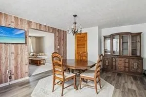 a dining room with furniture and window