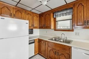 533 A Walnut Street Vandergrift, PA 15690 - Photo 14 of 46 a kitchen with stainless steel appliances a refrigerator and a sink