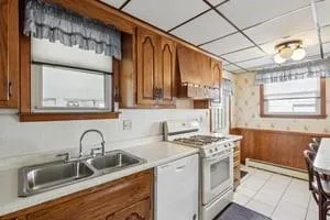 a kitchen that has a sink and a stove