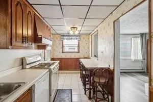 a kitchen with a sink cabinets and window