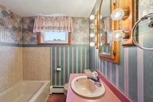 533 A Walnut Street Vandergrift, PA 15690 - Photo 19 of 46 a bathroom with a sink and a mirror