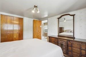 533 A Walnut Street Vandergrift, PA 15690 - Photo 22 of 46 a bedroom with a bed and a large mirror on the dresser
