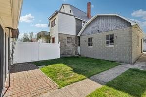 533 A Walnut Street Vandergrift, PA 15690 - Photo 41 of 46 a front view of a house with garden