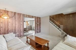 533 A Walnut Street Vandergrift, PA 15690 - Photo 8 of 46 a living room with furniture and a chandelier