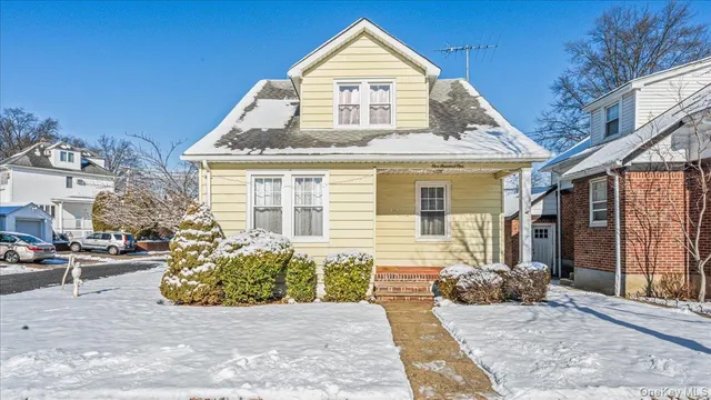 a view of a brick house with many windows