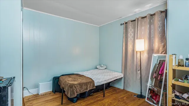 a bedroom with a bed and a bookshelf