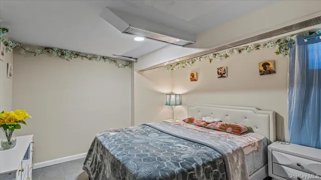 a bedroom with a bed and a table in it