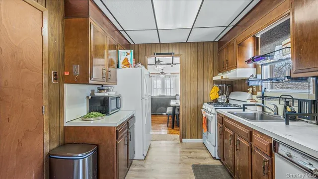 a kitchen with refrigerator and cabinets