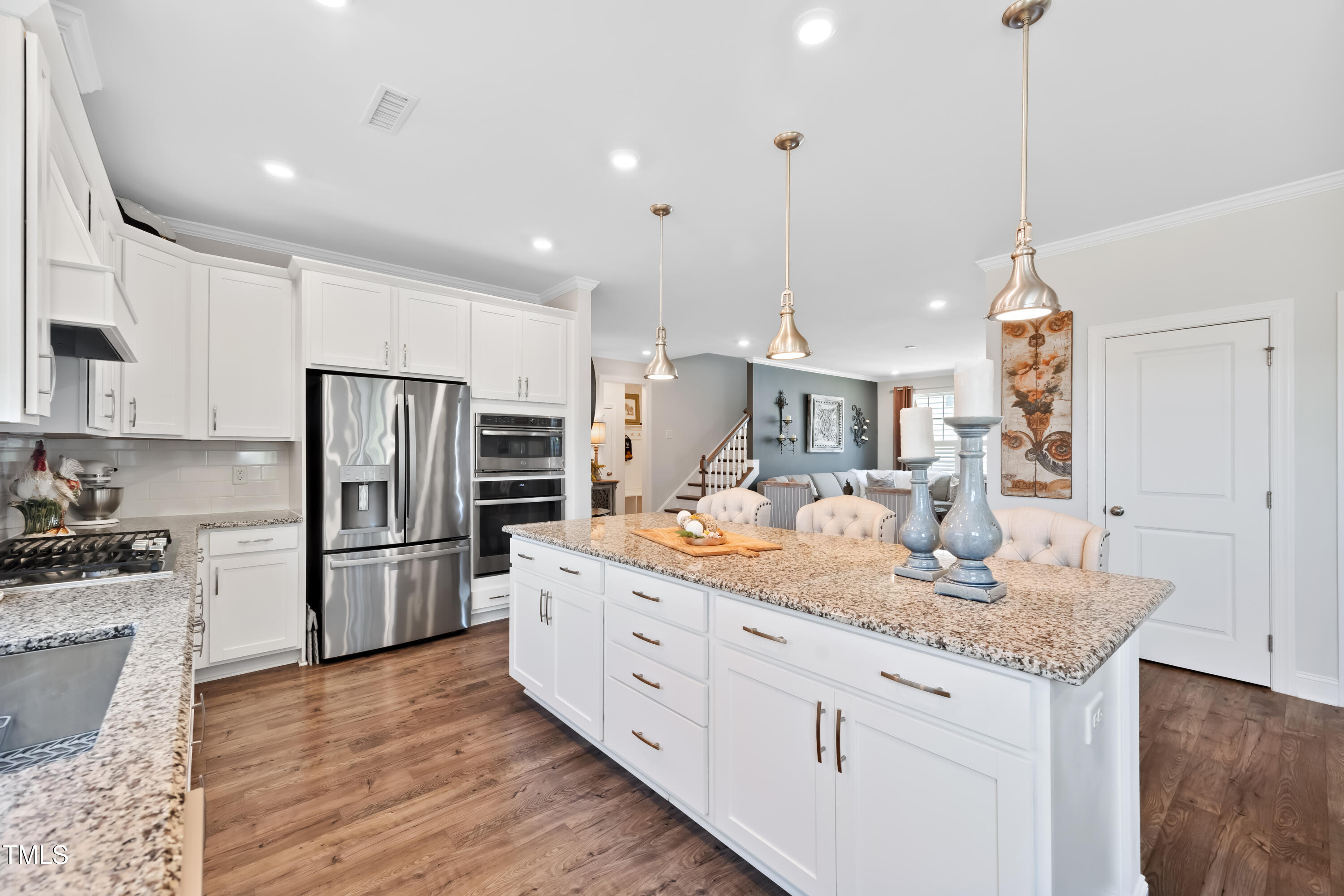 94 Two Creeks Loop Chapel Hill, NC 27517 - Photo 20 of 59 a kitchen with stainless steel appliances granite countertop a sink stove and refrigerator
