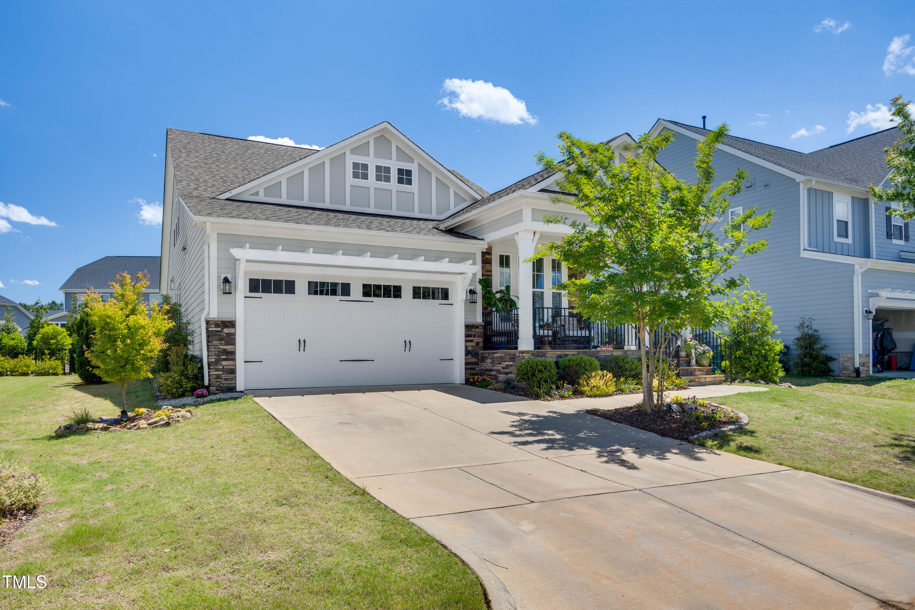 94 Two Creeks Loop Chapel Hill, NC 27517 - Photo 2 of 59 a view of a house with a yard and potted plants