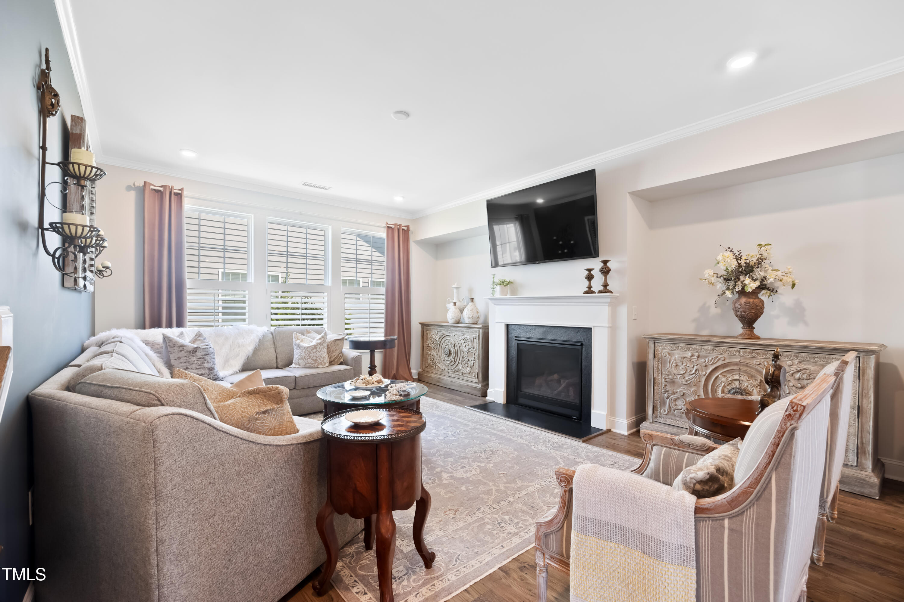 94 Two Creeks Loop Chapel Hill, NC 27517 - Photo 23 of 59 a living room with furniture a fireplace and a flat screen tv