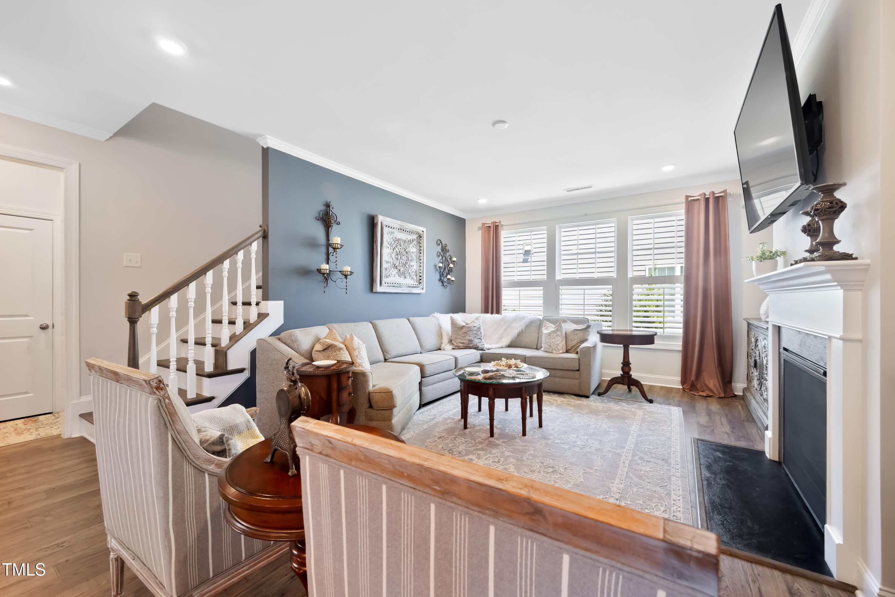 94 Two Creeks Loop Chapel Hill, NC 27517 - Photo 24 of 59 a living room with furniture fireplace and flat screen tv