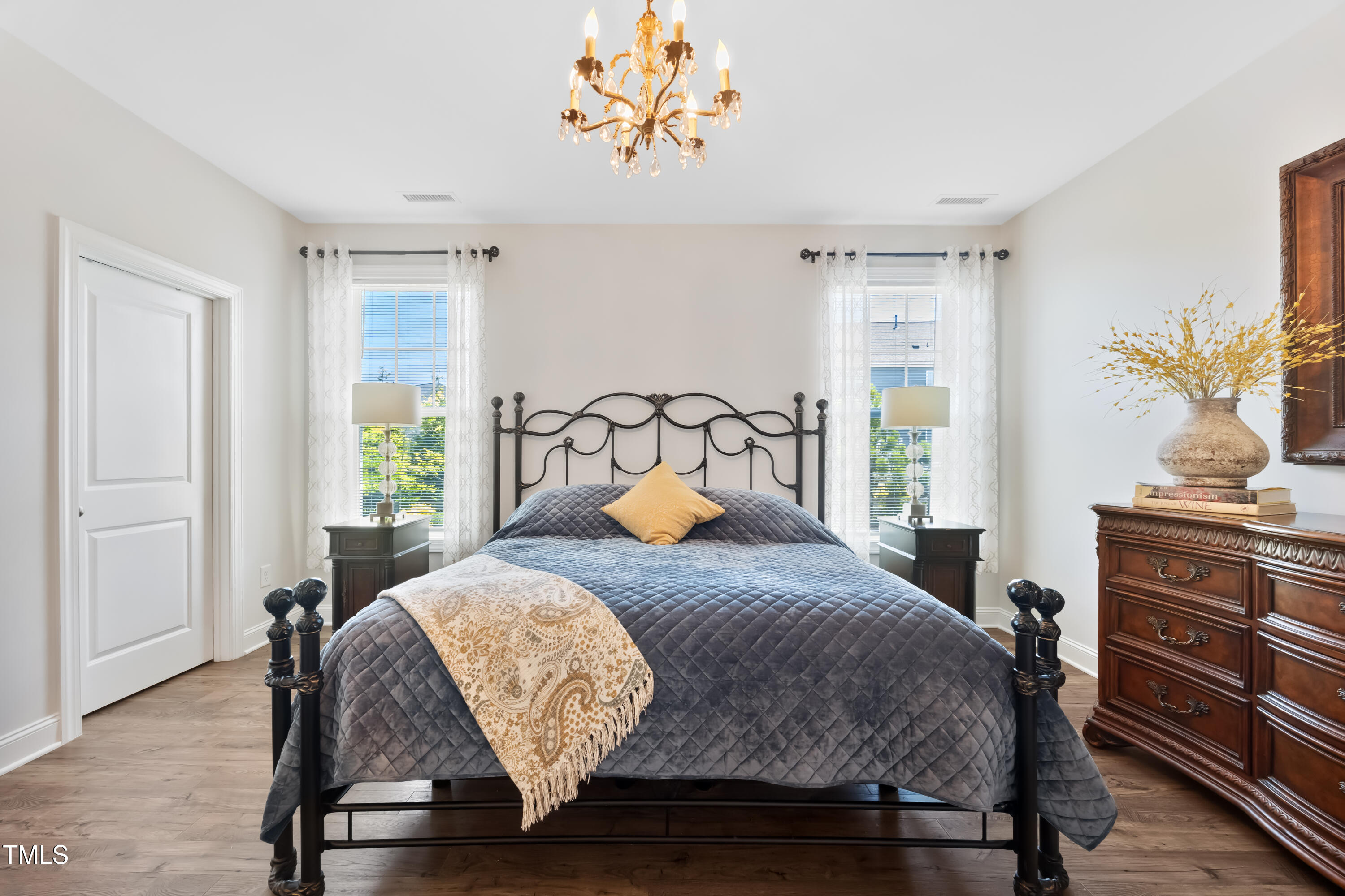94 Two Creeks Loop Chapel Hill, NC 27517 - Photo 26 of 59 a bedroom with a bed and wooden floor