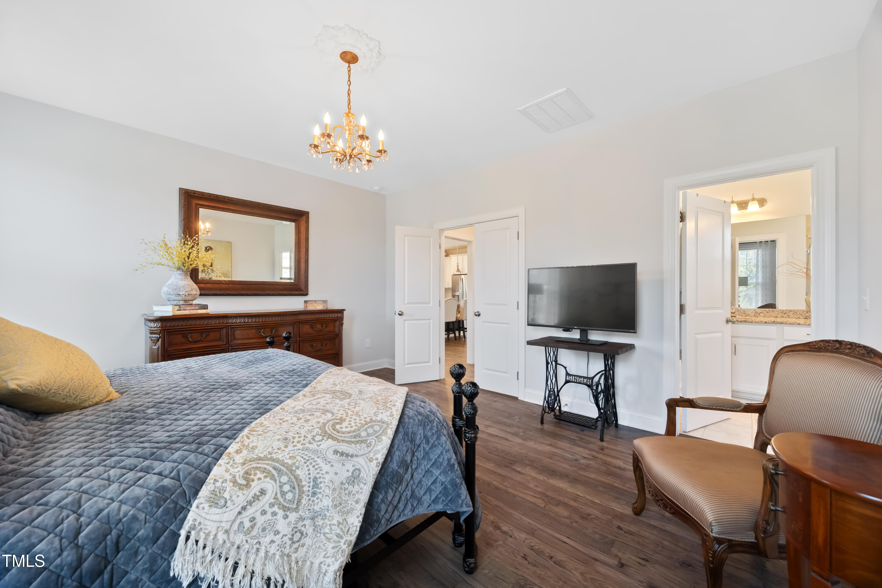 94 Two Creeks Loop Chapel Hill, NC 27517 - Photo 28 of 59 a bedroom with furniture and a flat screen tv