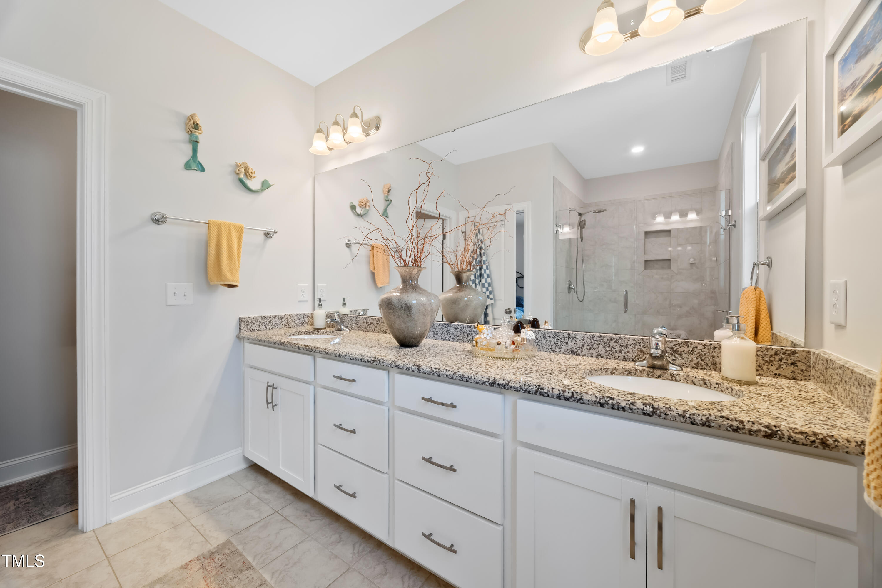 94 Two Creeks Loop Chapel Hill, NC 27517 - Photo 29 of 59 a bathroom with double sink and a mirror