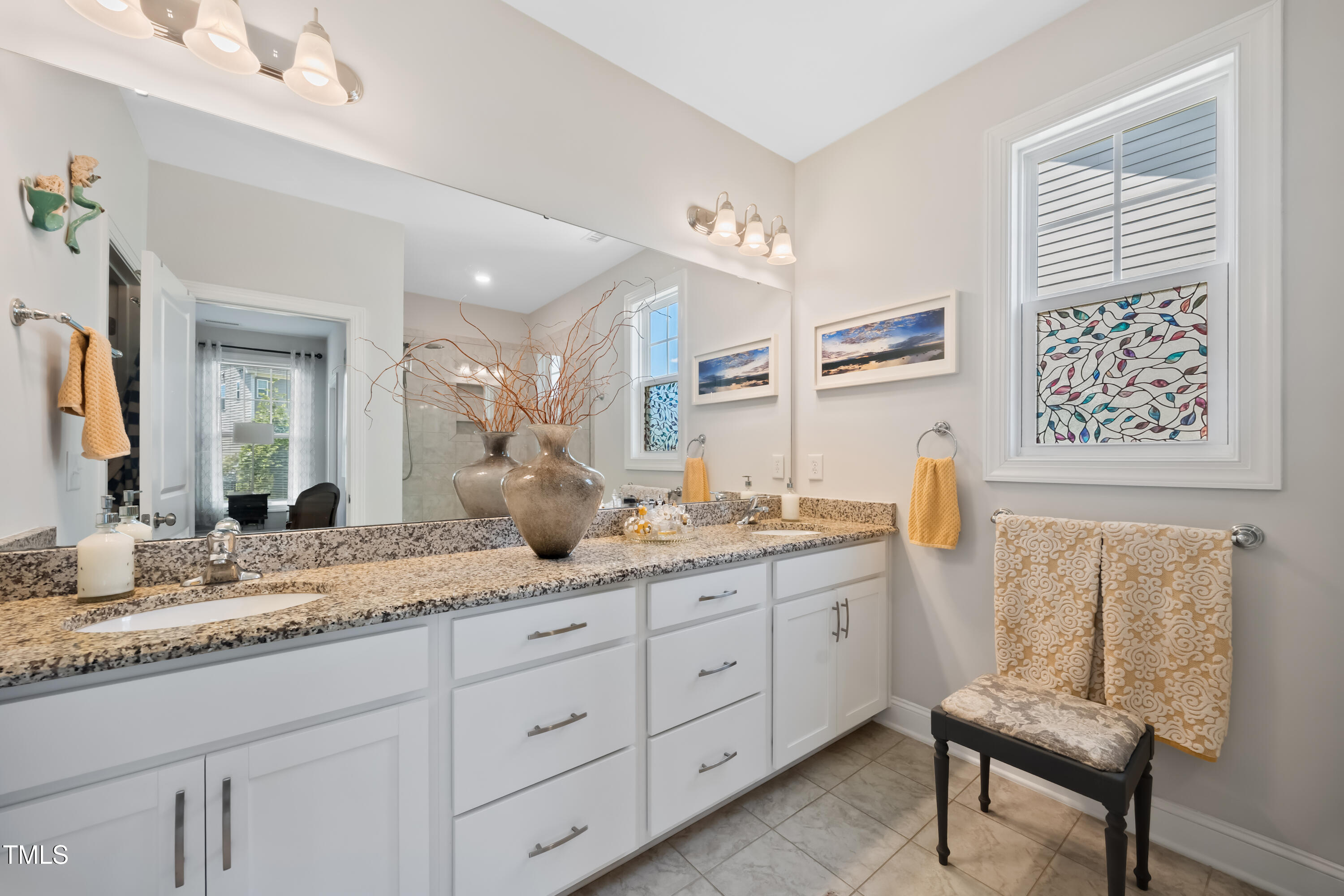 94 Two Creeks Loop Chapel Hill, NC 27517 - Photo 30 of 59 a bathroom with a granite countertop sink and a mirror