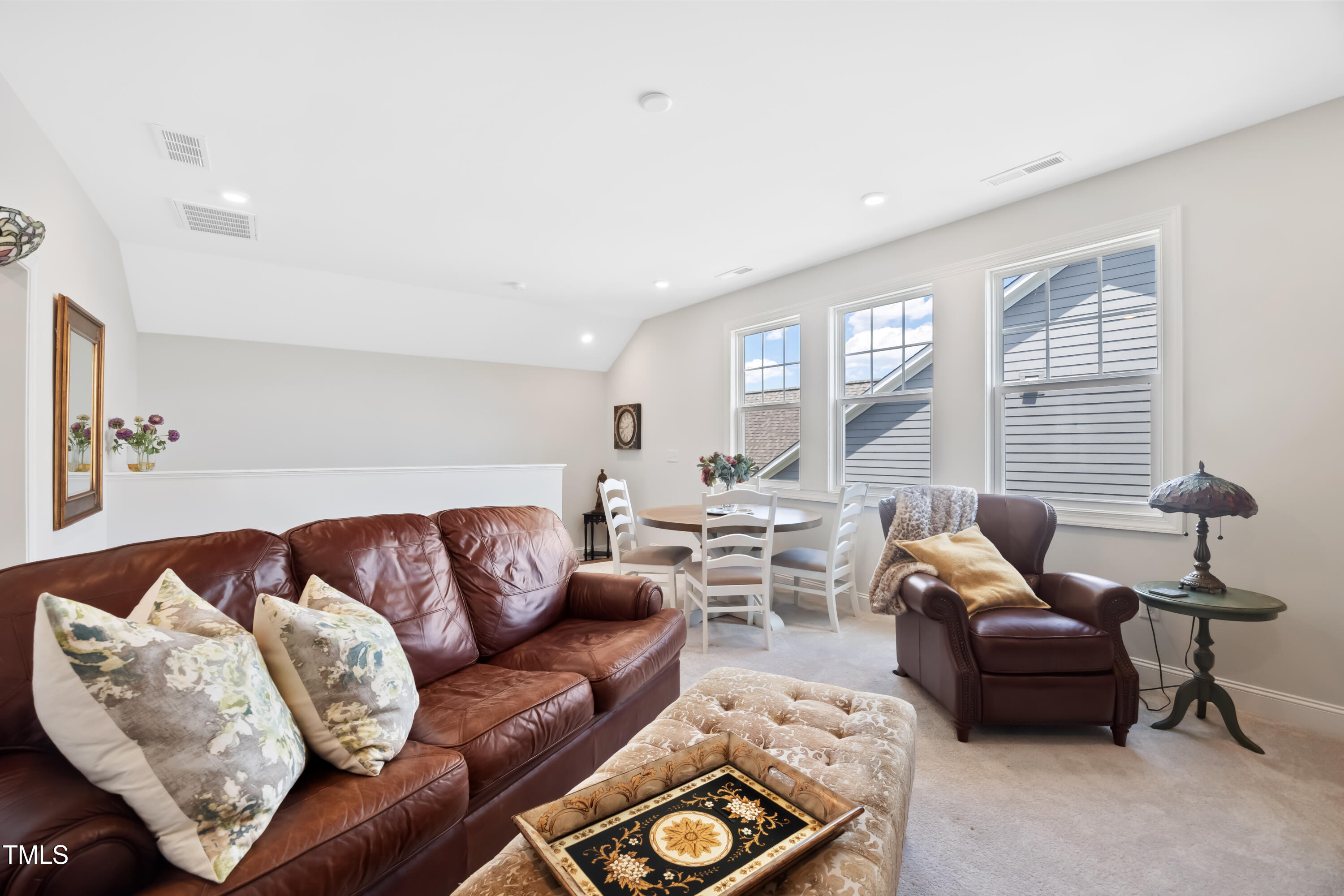 94 Two Creeks Loop Chapel Hill, NC 27517 - Photo 37 of 59 a living room with furniture and a large window