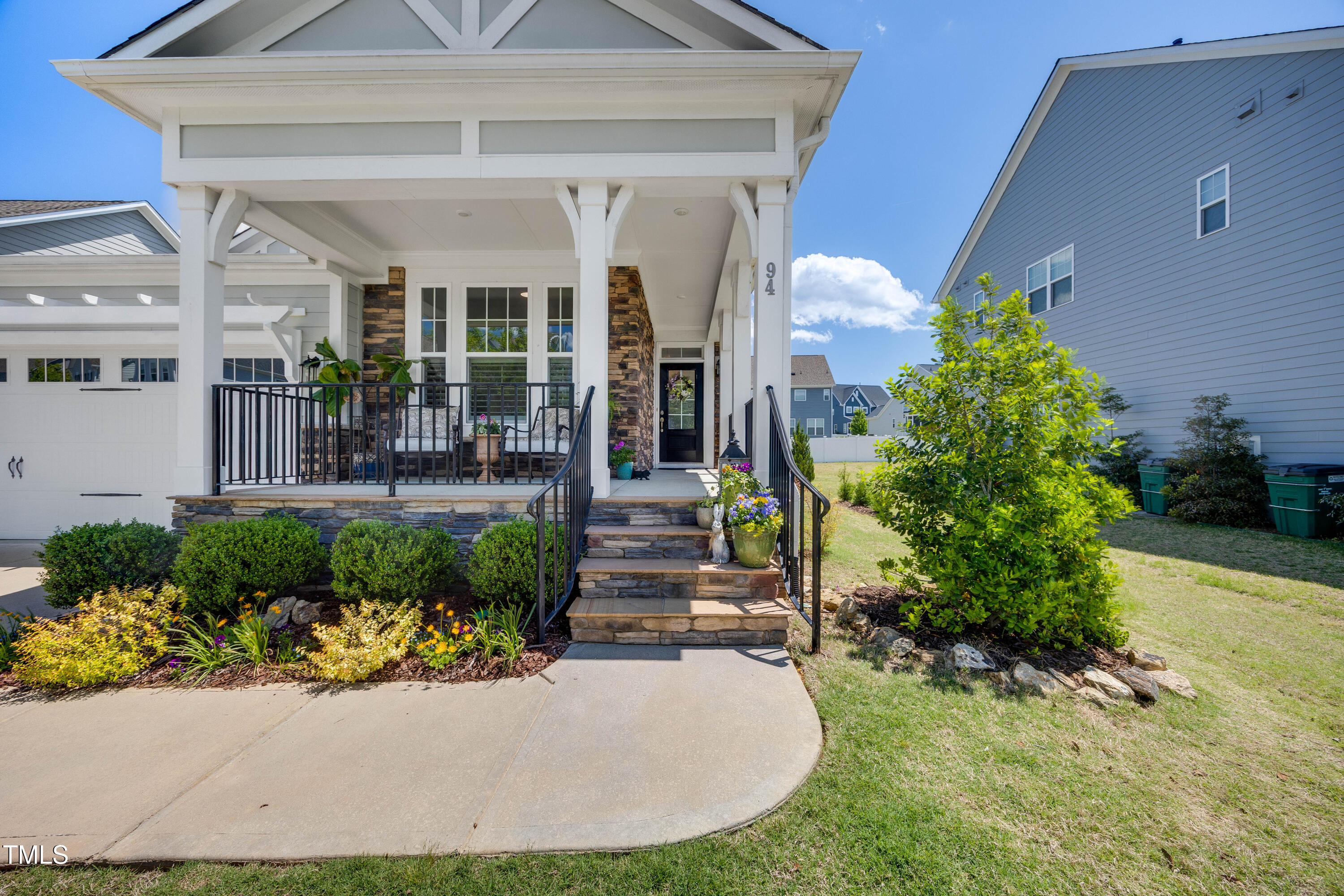 94 Two Creeks Loop Chapel Hill, NC 27517 - Photo 4 of 59 a front view of a house with garden