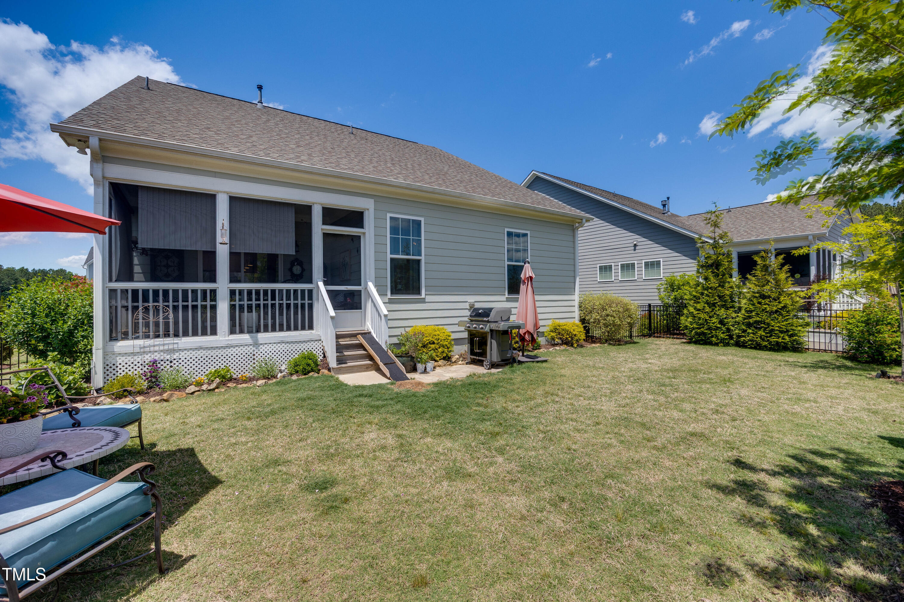 94 Two Creeks Loop Chapel Hill, NC 27517 - Photo 41 of 59 a view of a house with backyard and porch