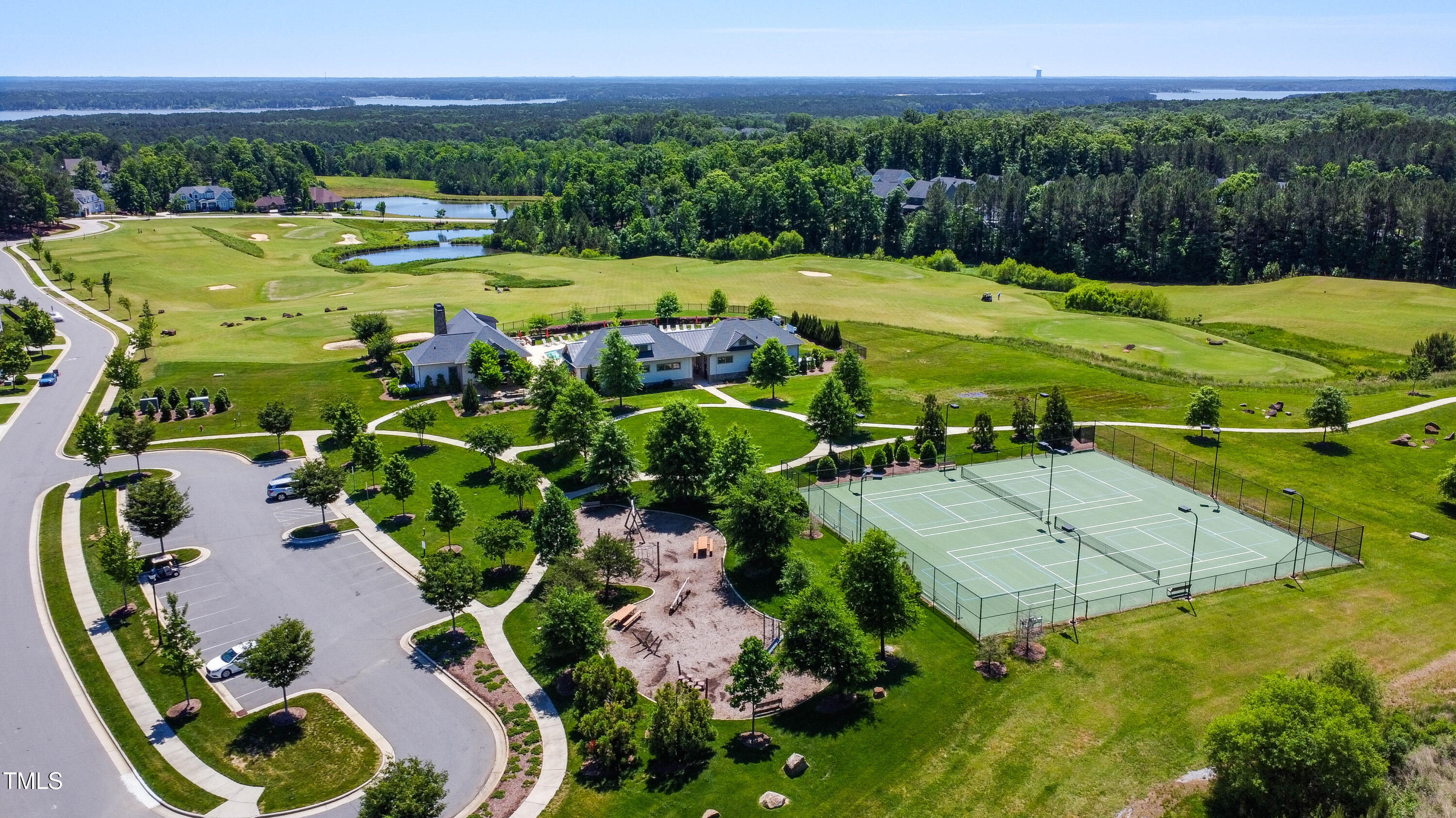 94 Two Creeks Loop Chapel Hill, NC 27517 - Photo 47 of 59 a view of a swimming pool with a yard