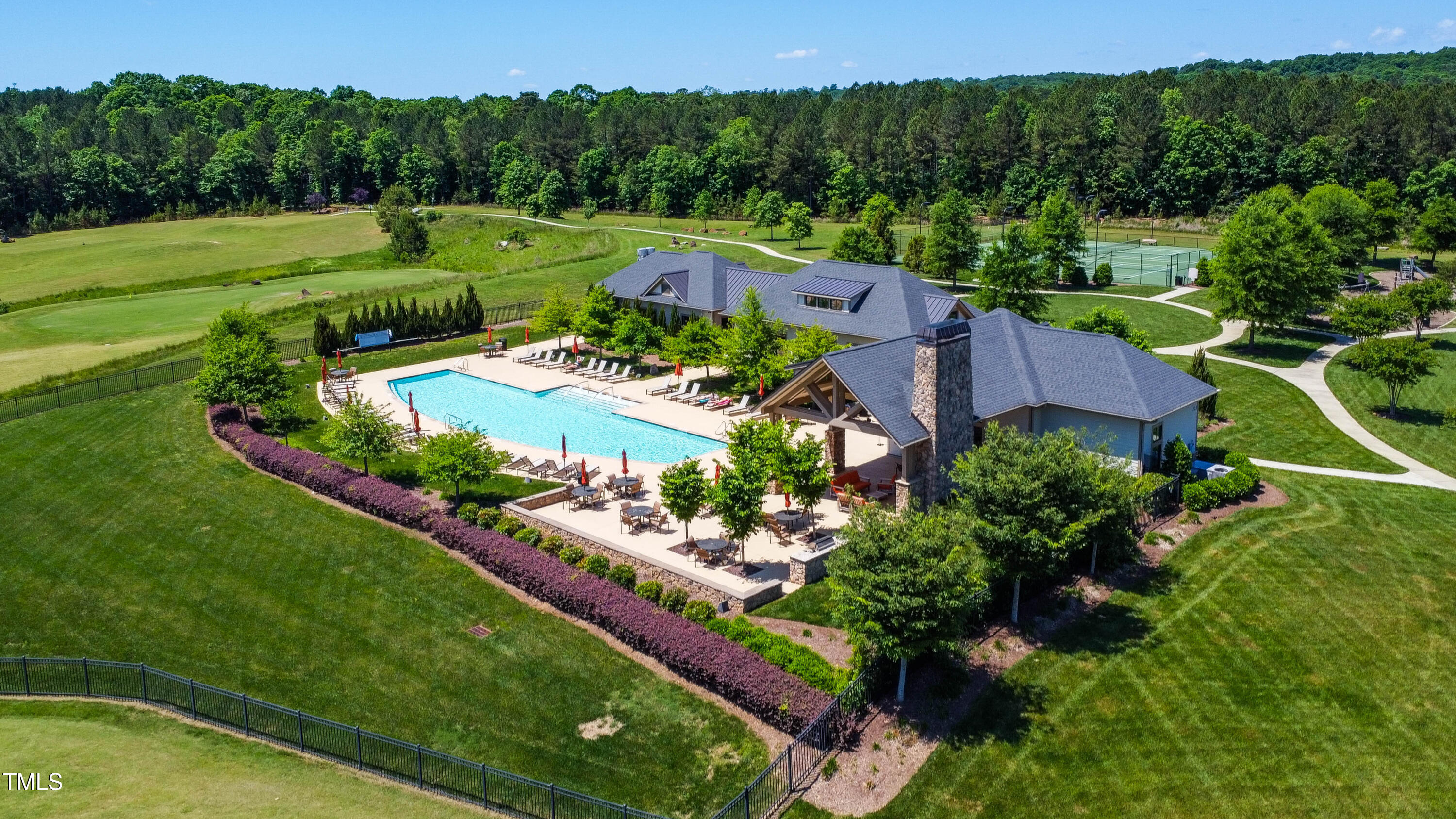 94 Two Creeks Loop Chapel Hill, NC 27517 - Photo 48 of 59 a view of a garden with a lake