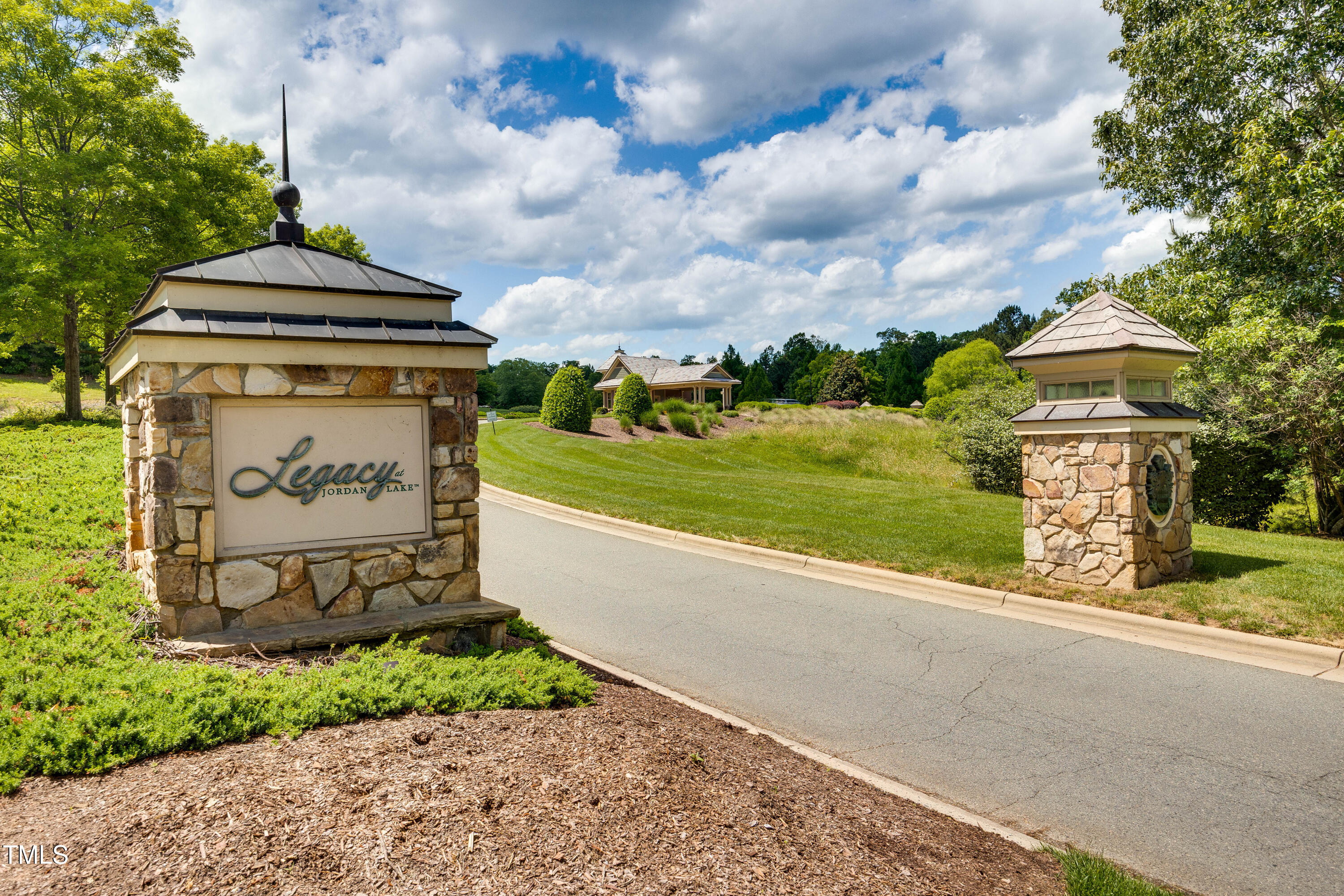 94 Two Creeks Loop Chapel Hill, NC 27517 - Photo 55 of 59 a sign board with a play ground in the back