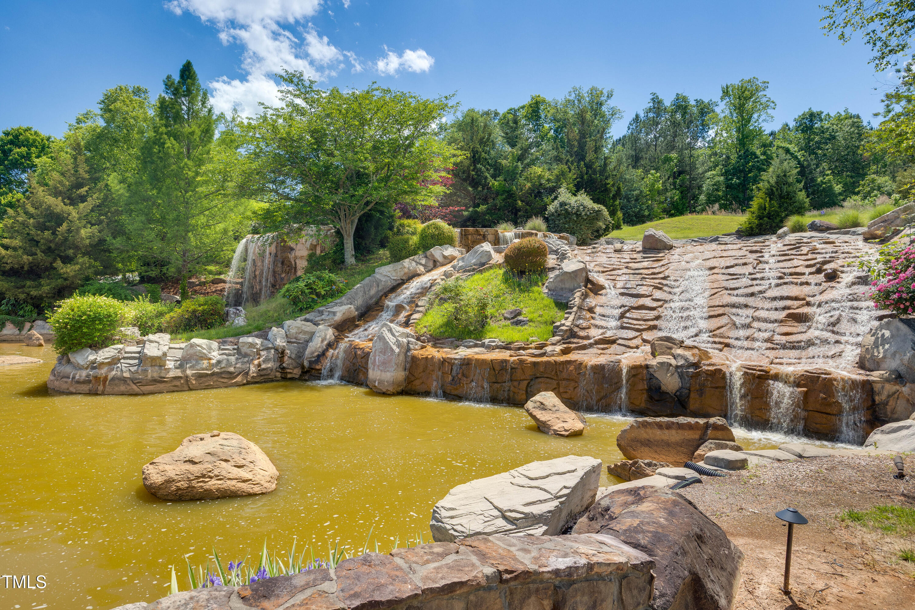 94 Two Creeks Loop Chapel Hill, NC 27517 - Photo 57 of 59 a view of a swimming pool with a patio