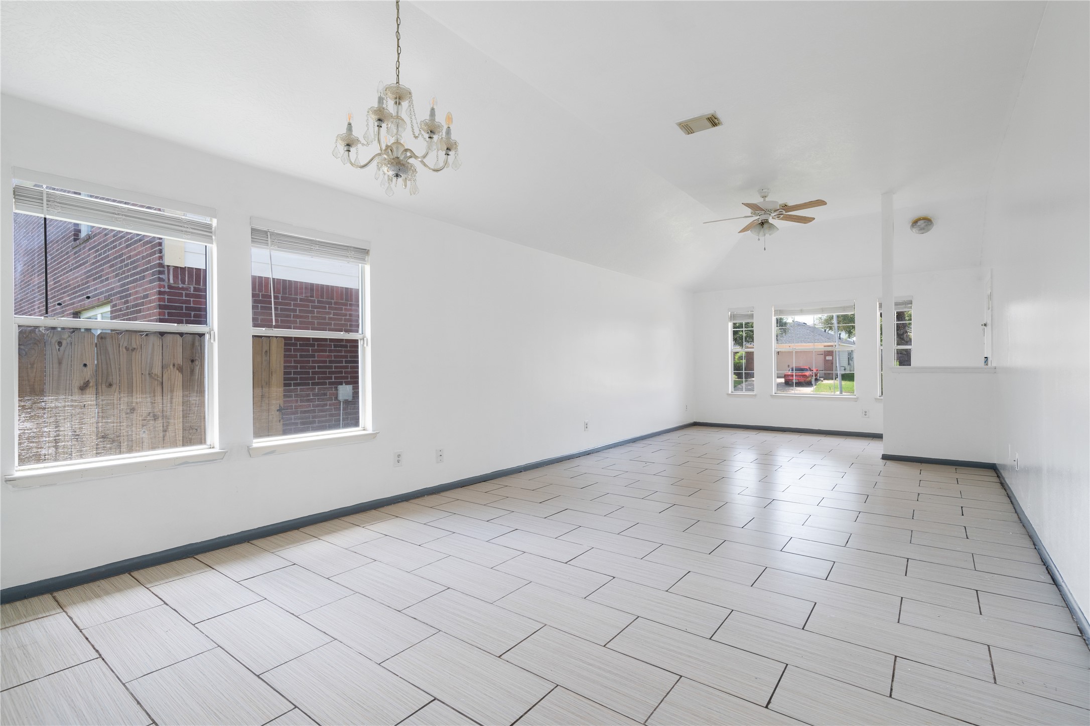 19431 River Bottom Road Katy, TX 77449 - Photo 3 of 12 a view of an empty room with a window