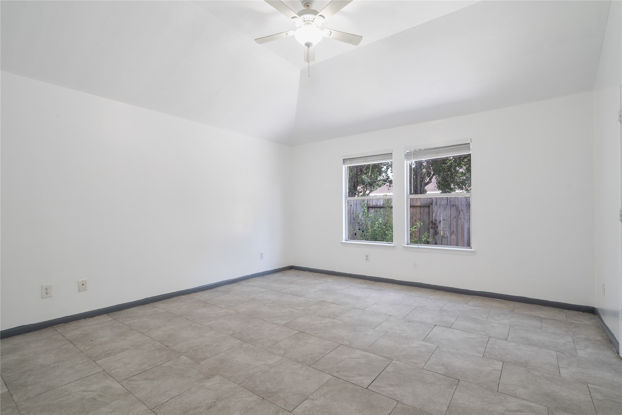 19431 River Bottom Road Katy, TX 77449 - Photo 6 of 12 a view of an empty room with a window
