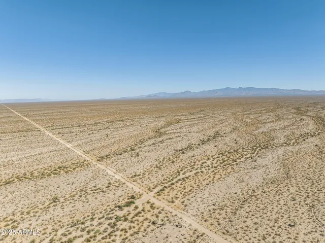 a view of an ocean beach and mountain