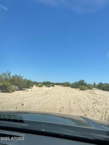 a view of a mountain range with trees in the background
