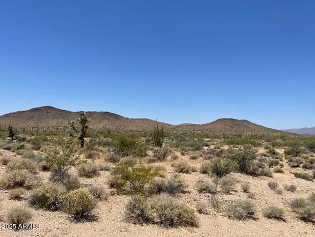 a street sign in front of a house