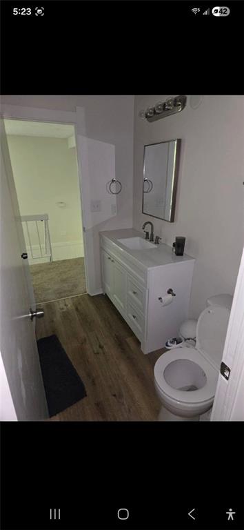 1086 Village Road Stone Mountain, GA 30088 - Photo 15 of 22 a bathroom with a sink a mirror and toilet