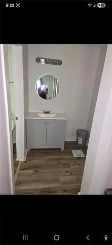 a view of kitchen island with wooden floor