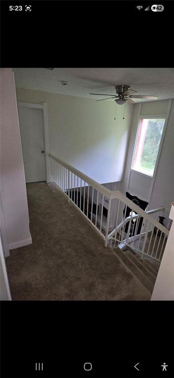 1086 Village Road Stone Mountain, GA 30088 - Photo 22 of 22 a view of staircase with white walls