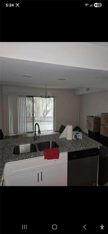 1086 Village Road Stone Mountain, GA 30088 - Photo 3 of 22 a kitchen with a sink and a stove