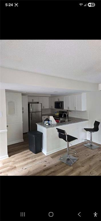 1086 Village Road Stone Mountain, GA 30088 - Photo 4 of 22 a view of a kitchen with kitchen island sink and stove
