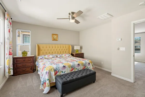 a bedroom with a bed and window