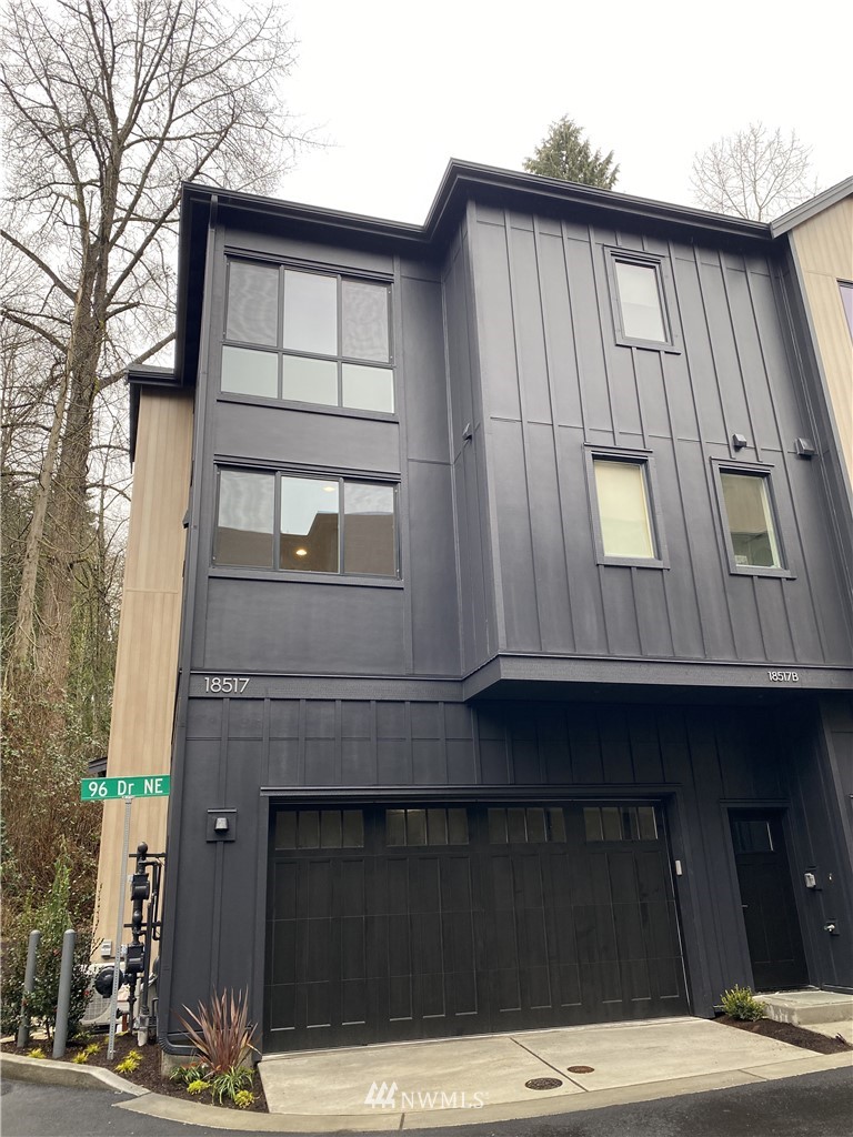 a front view of a house with garage