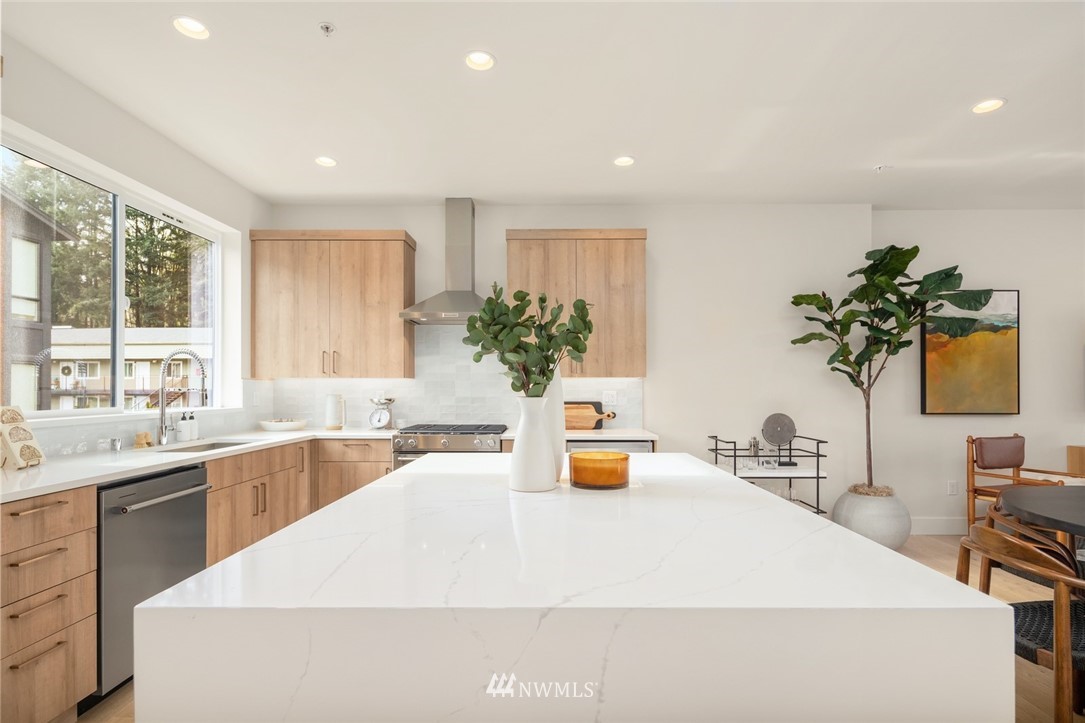 18517 96th Drive Northeast, Unit A Bothell, WA 98011 - Photo 11 of 31 a kitchen with a sink and a large window