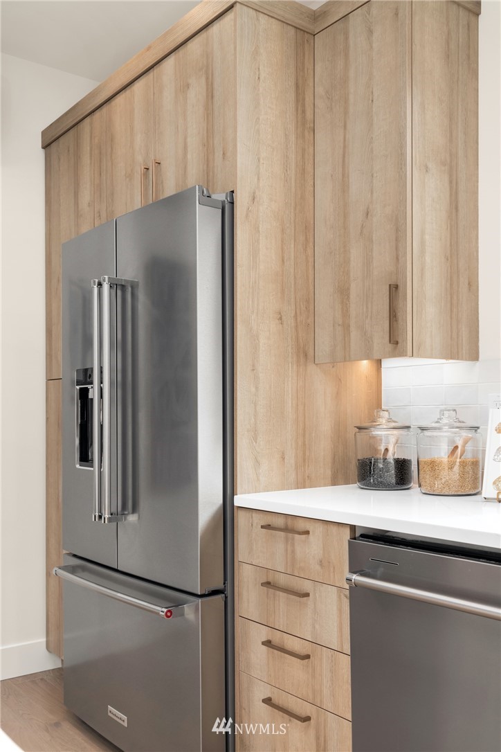 18517 96th Drive Northeast, Unit A Bothell, WA 98011 - Photo 15 of 31 a kitchen with a refrigerator and cabinets