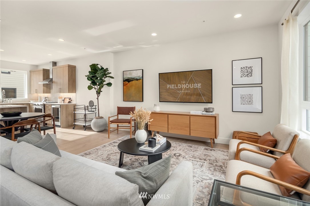 18517 96th Drive Northeast, Unit A Bothell, WA 98011 - Photo 19 of 31 a living room with furniture and a flat screen tv