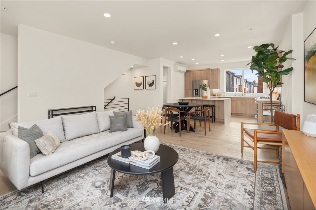 18517 96th Drive Northeast, Unit A Bothell, WA 98011 - Photo 20 of 31 a living room with furniture and a wooden floor